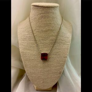 Silver necklace with a beautiful brown crystal